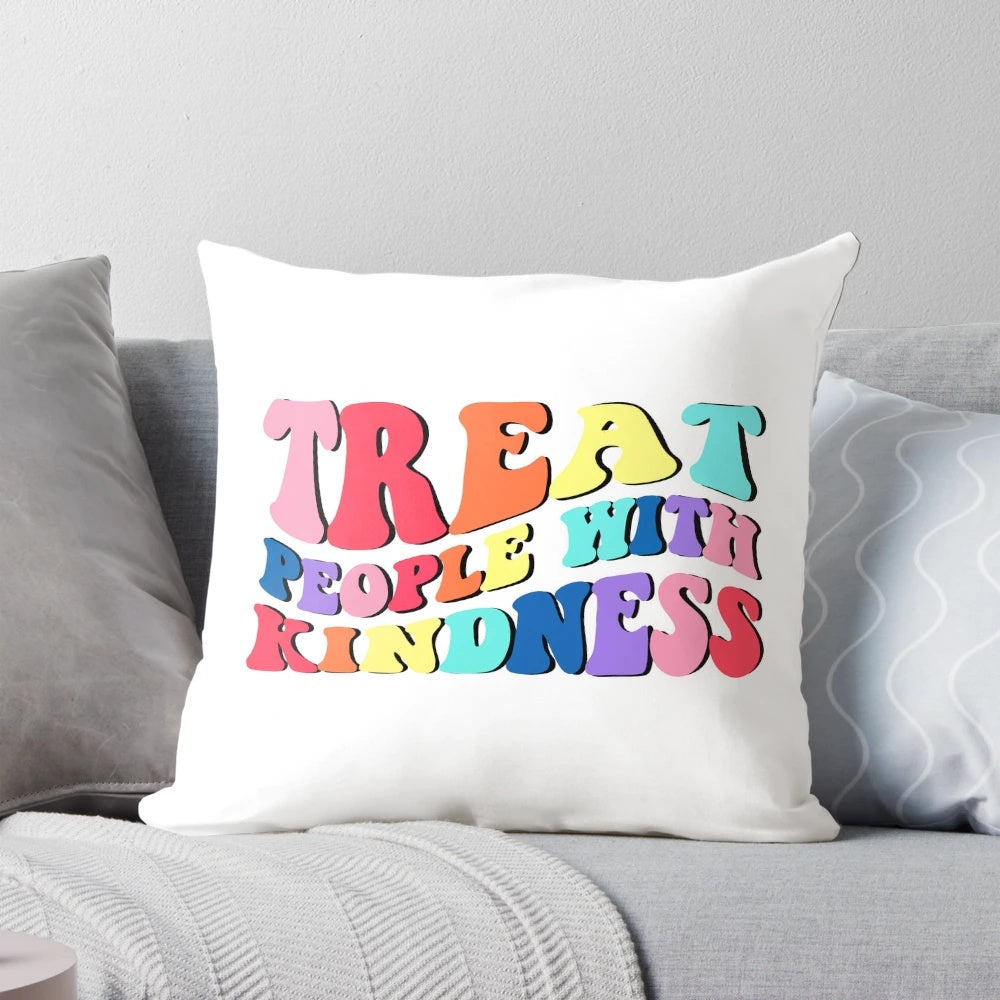 A soft, cozy pillow featuring the text "Treat People With Kindness", inspired by Harry Styles' message of kindness.