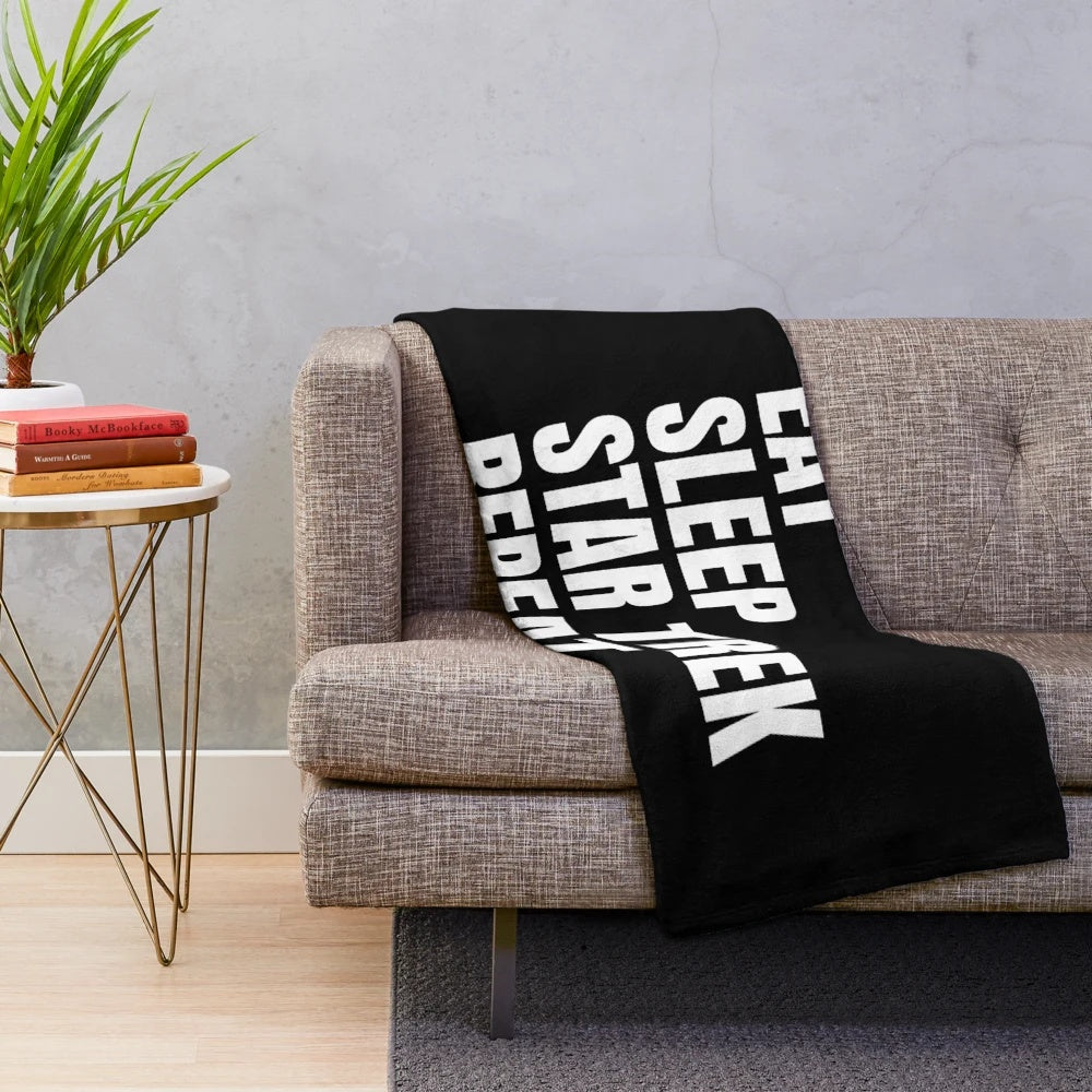 Star Trek inspired plush blanket with "Eat Sleep Star Trek Repeat" design
