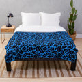 Blue leopard print plush blanket with a soft, cozy texture