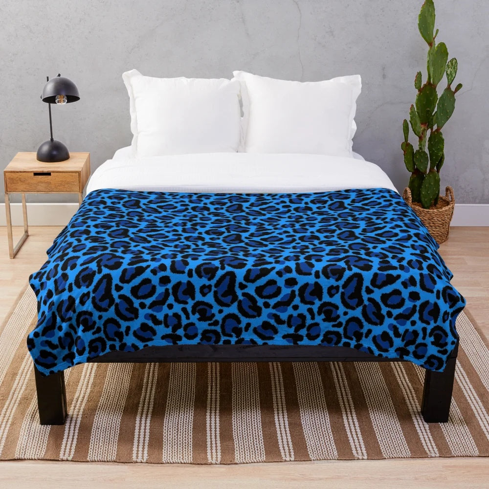 Blue leopard print plush blanket with a soft, cozy texture