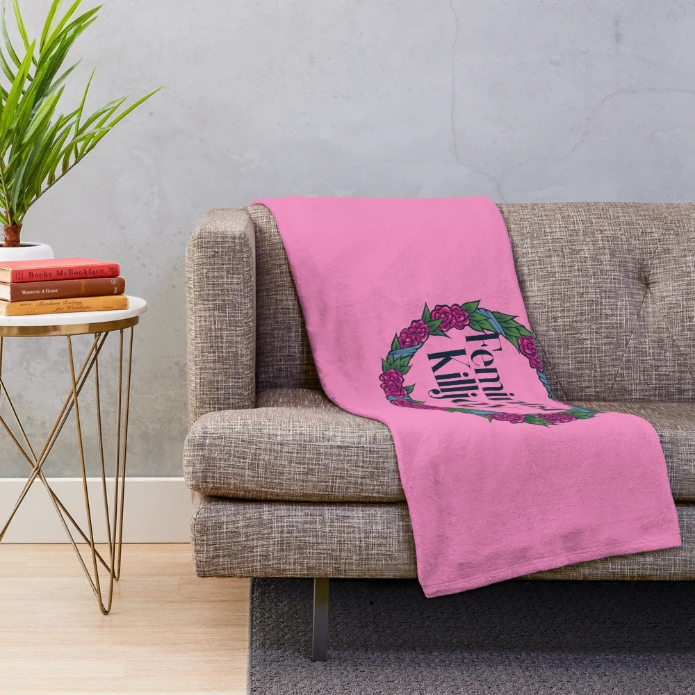 Feminist Killjoy plush blanket with a floral wreath design