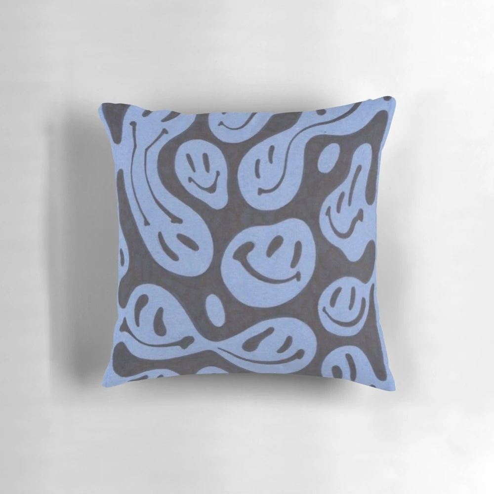 A vibrant smiley face pillow with a trendy, grunge aesthetic