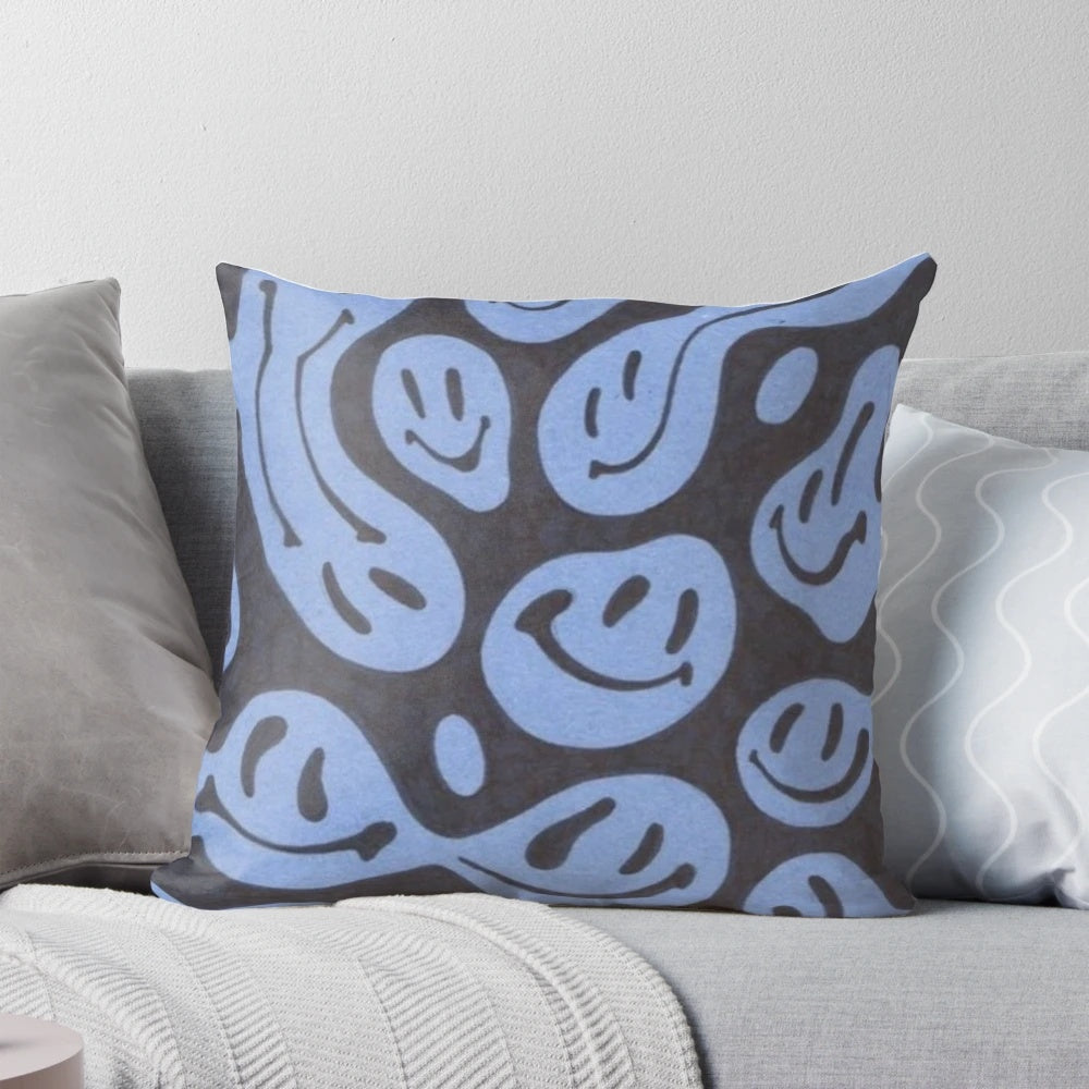 A vibrant smiley face pillow with a trendy, grunge aesthetic