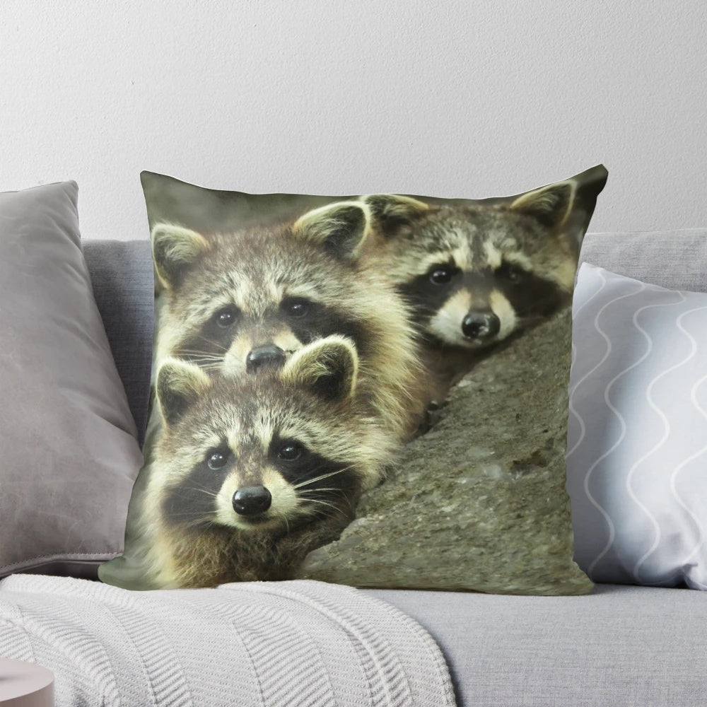 Tres Banditos Pillow featuring a playful raccoon design