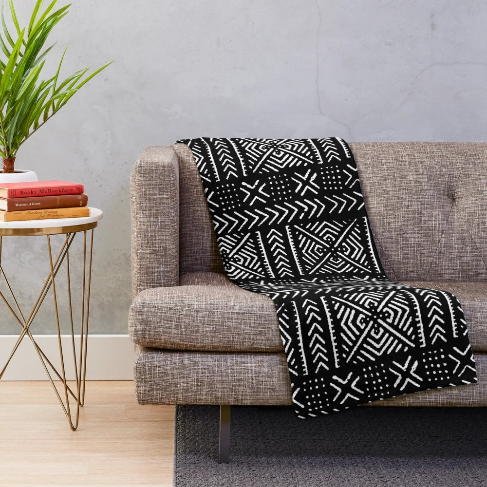 Black plush blanket with mud cloth inspired tribal pattern