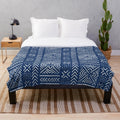 Tribal-inspired dark blue plush blanket featuring line mud cloth design