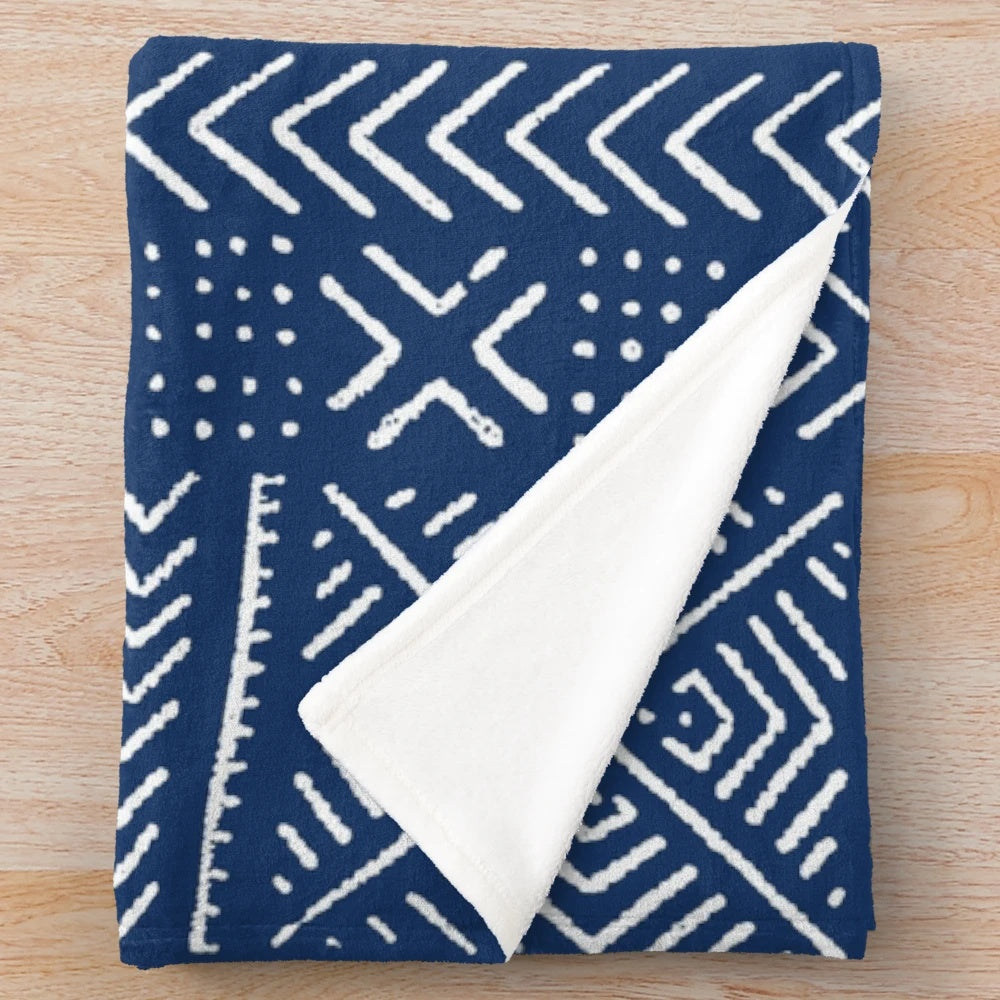 Tribal-inspired dark blue plush blanket featuring line mud cloth design