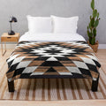 Tribal pattern plush blanket in modern aztec design with concrete and wood textures
