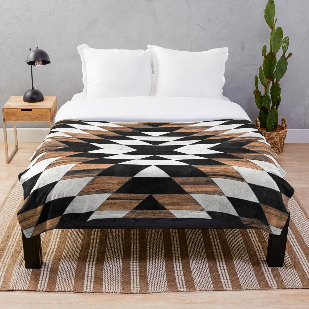 Tribal pattern plush blanket in modern aztec design with concrete and wood textures