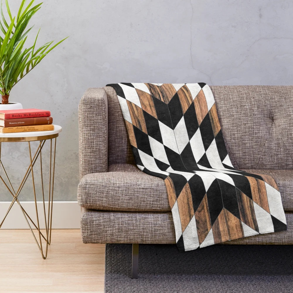 Tribal pattern plush blanket in modern aztec design with concrete and wood textures