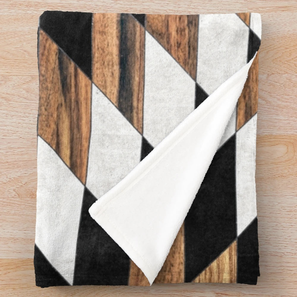 Tribal pattern plush blanket in modern aztec design with concrete and wood textures