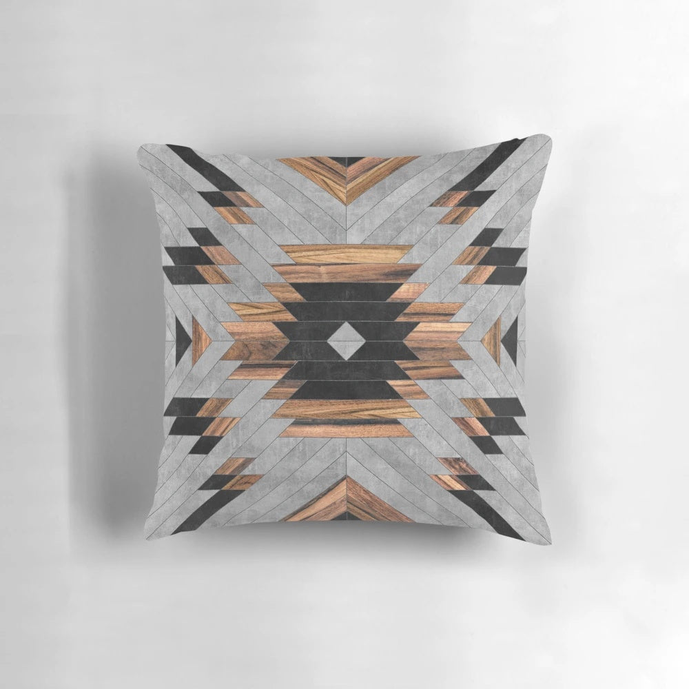 Tribal-inspired geometric pattern pillow with a mix of concrete and wood elements