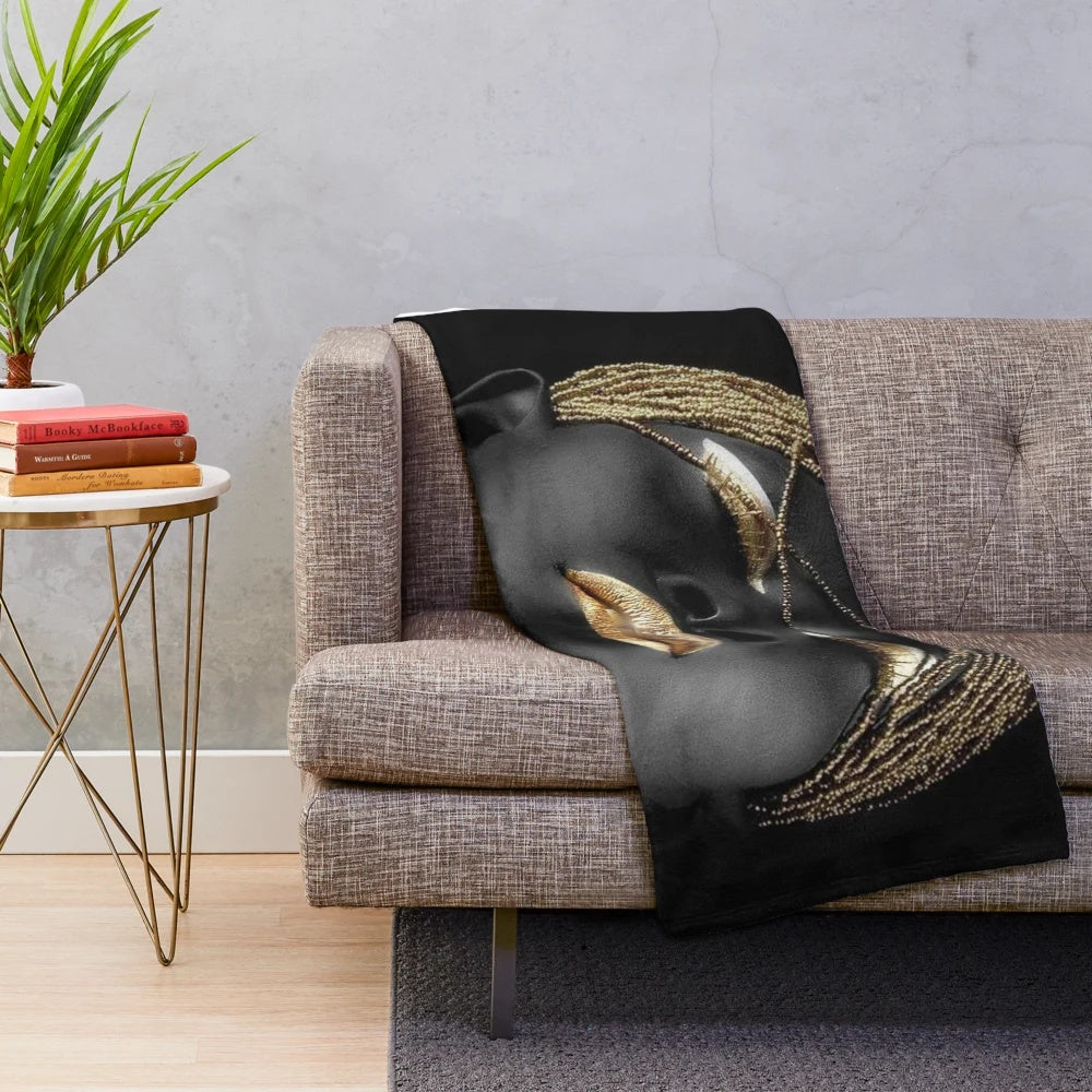 Tribal queen plush blanket with abstract black, gold, and cultural elements