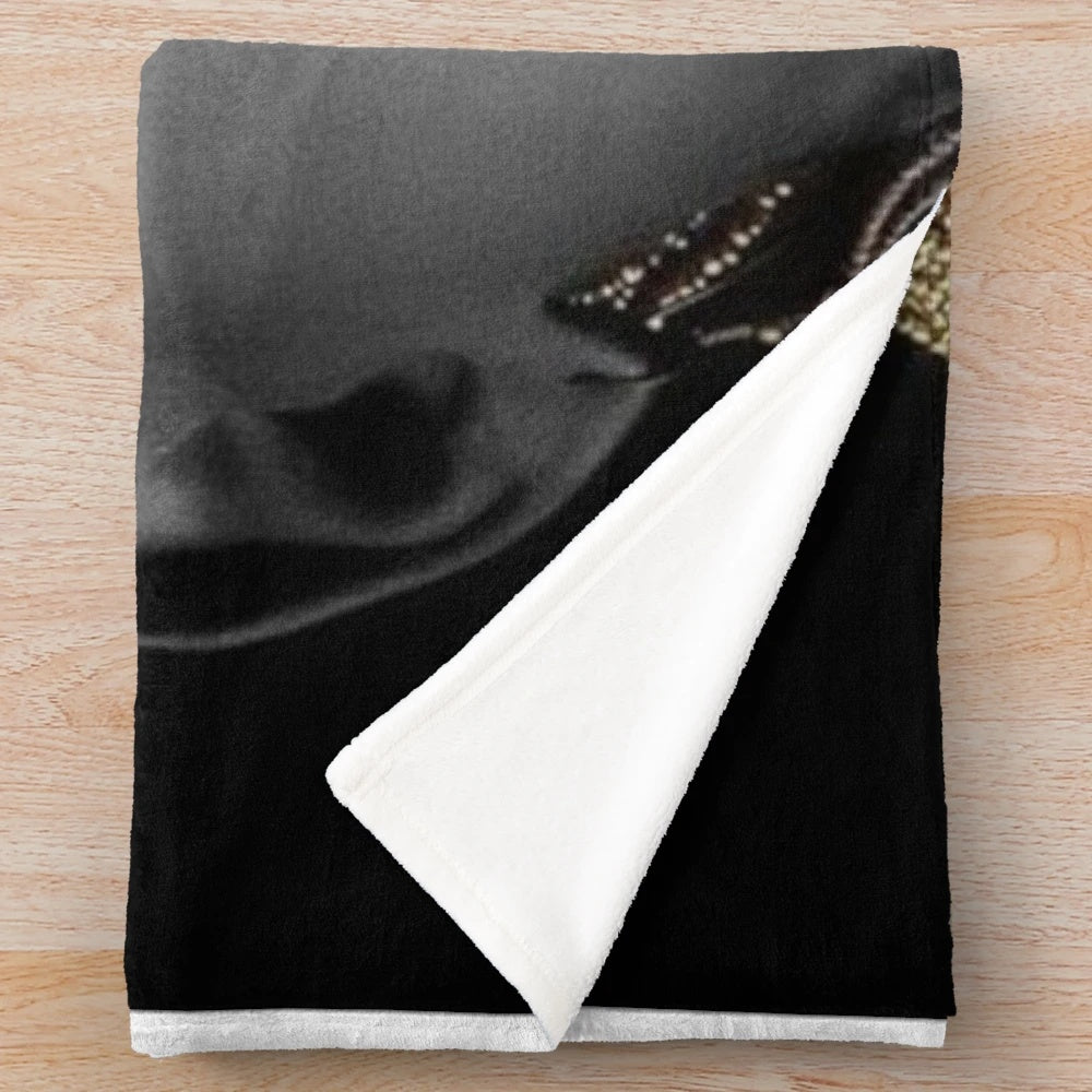 Tribal queen plush blanket with abstract black, gold, and cultural elements