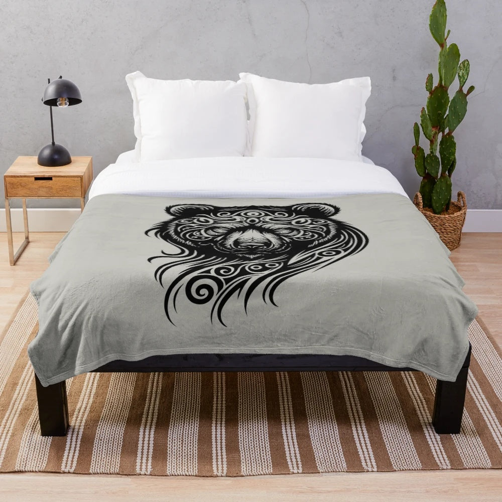 Tribal-inspired plush blanket featuring a silhouette of a legendary bear