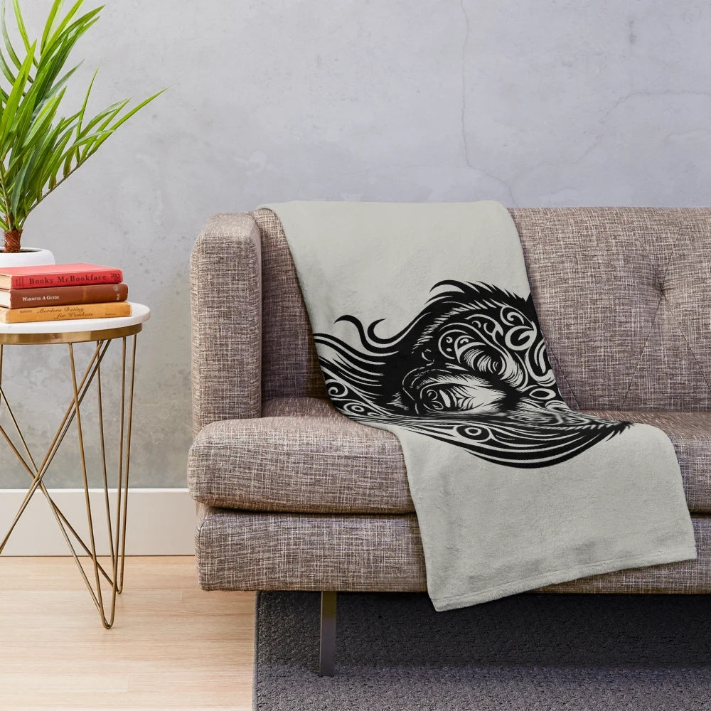 Tribal-inspired plush blanket featuring a silhouette of a legendary bear