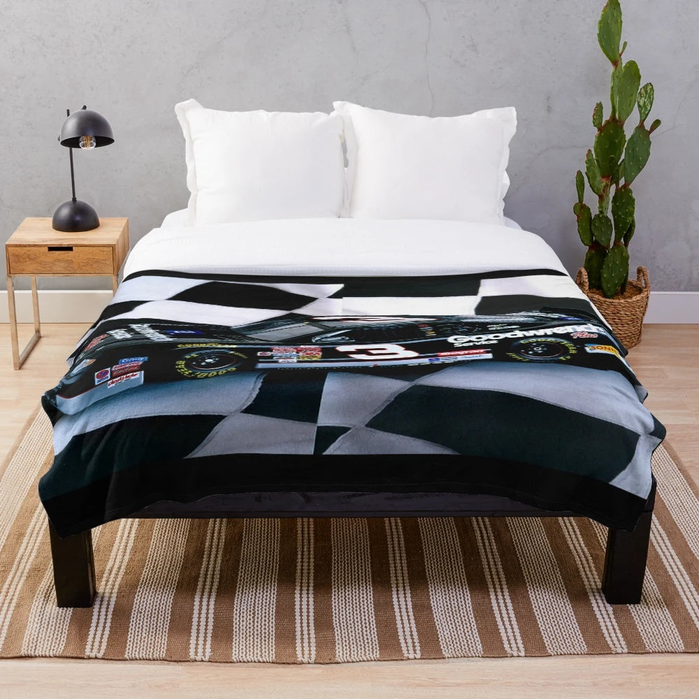 Plush black blanket featuring tribute design to NASCAR driver Dale Earnhardt