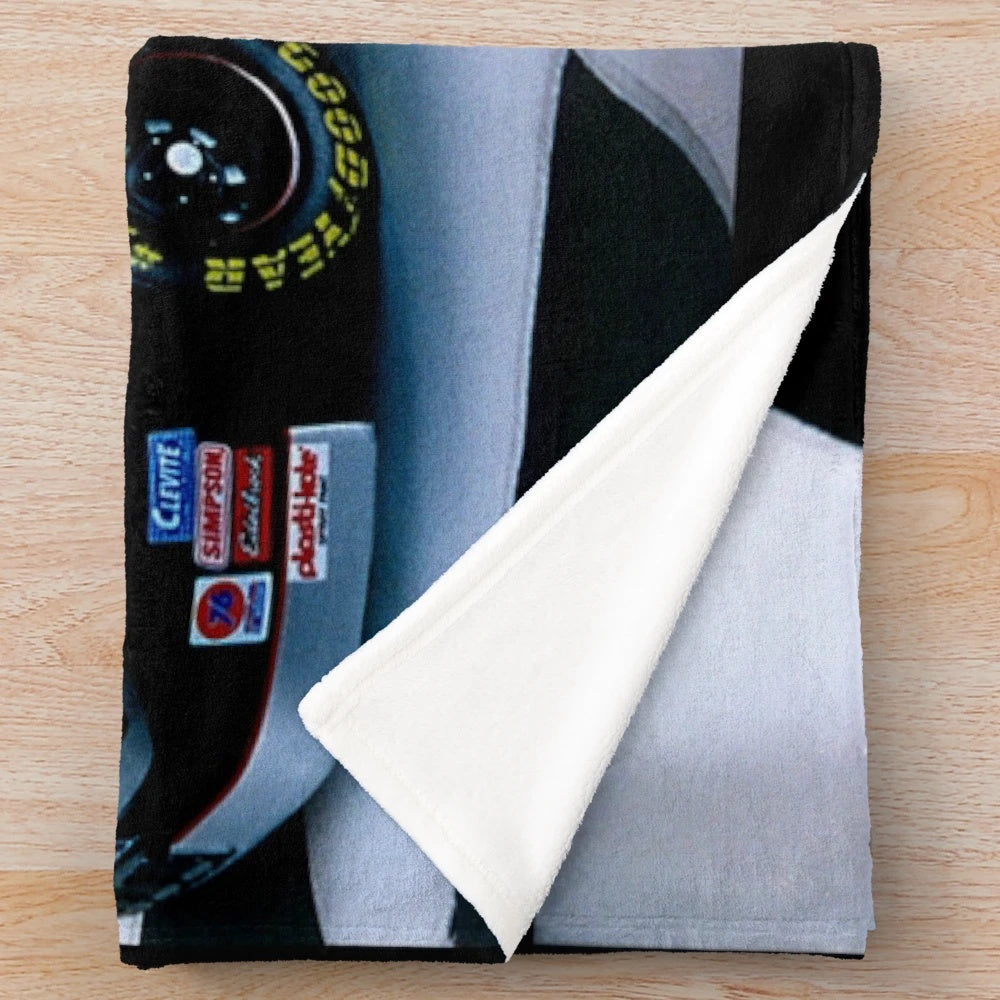 Plush black blanket featuring tribute design to NASCAR driver Dale Earnhardt