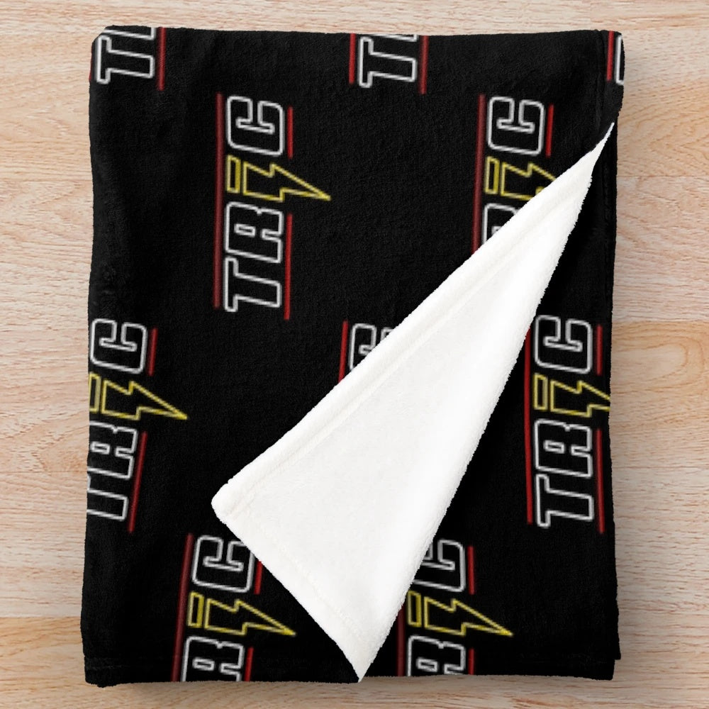 Tric Nightclub inspired plush blanket featuring soft, cozy material