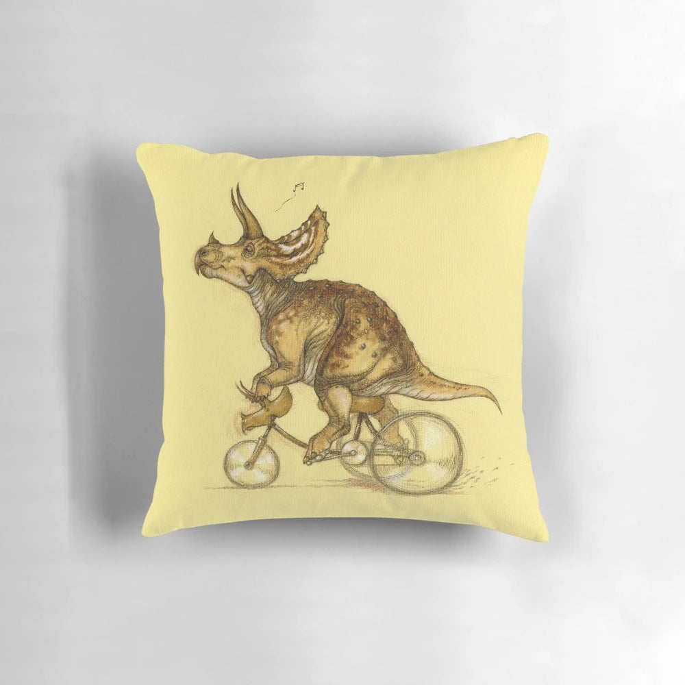 Image of a colorful, illustrated Triceratops dinosaur printed on a soft, plush pillow.