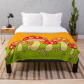 Soft, cozy plush blanket featuring a vibrant mushroom design in psychedelic colors