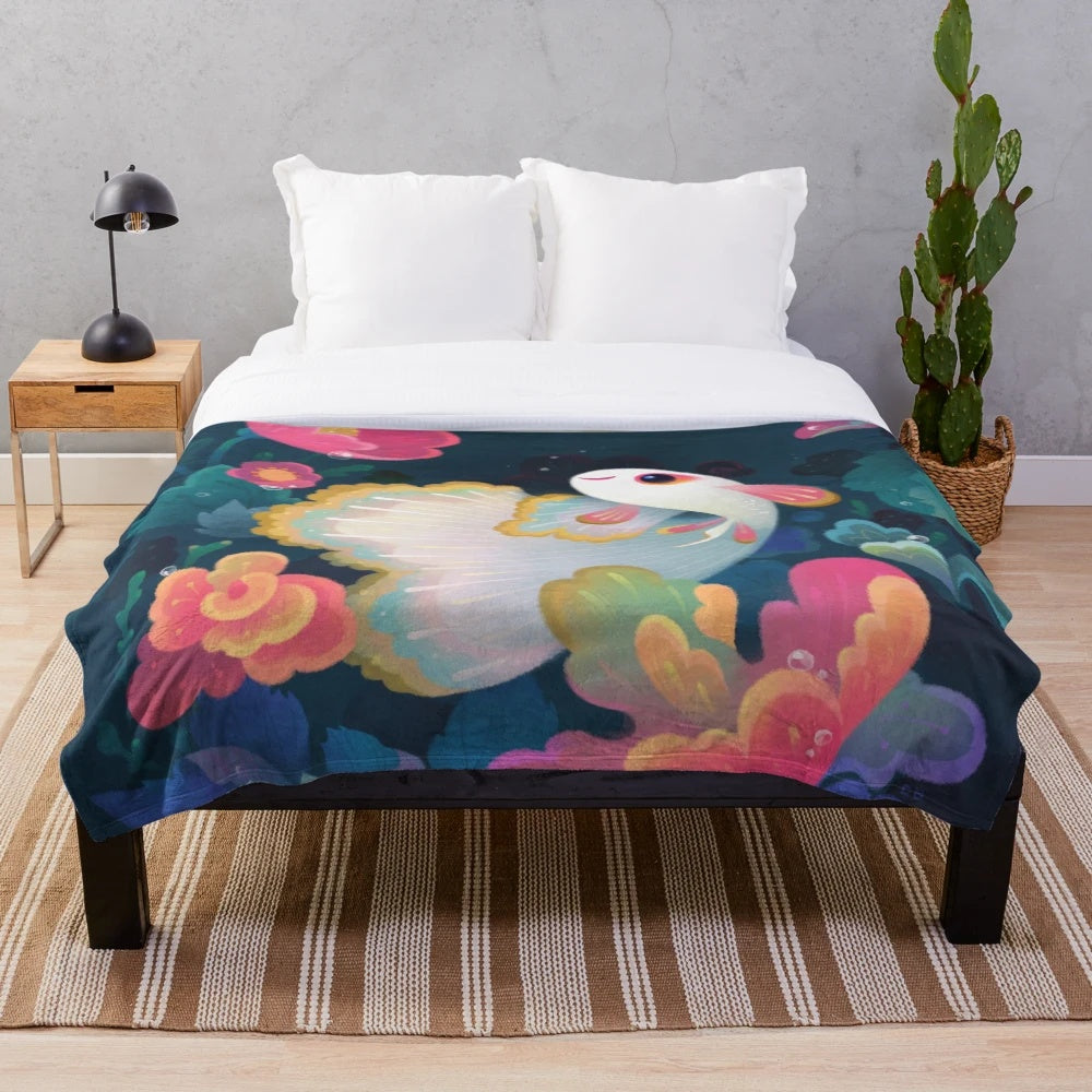 Plush blanket featuring a colorful floral guppy fish design