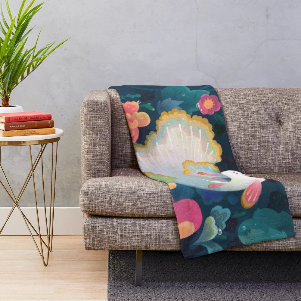 Plush blanket featuring a colorful floral guppy fish design