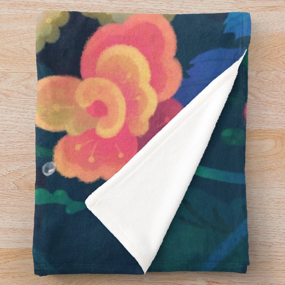 Plush blanket featuring a colorful floral guppy fish design