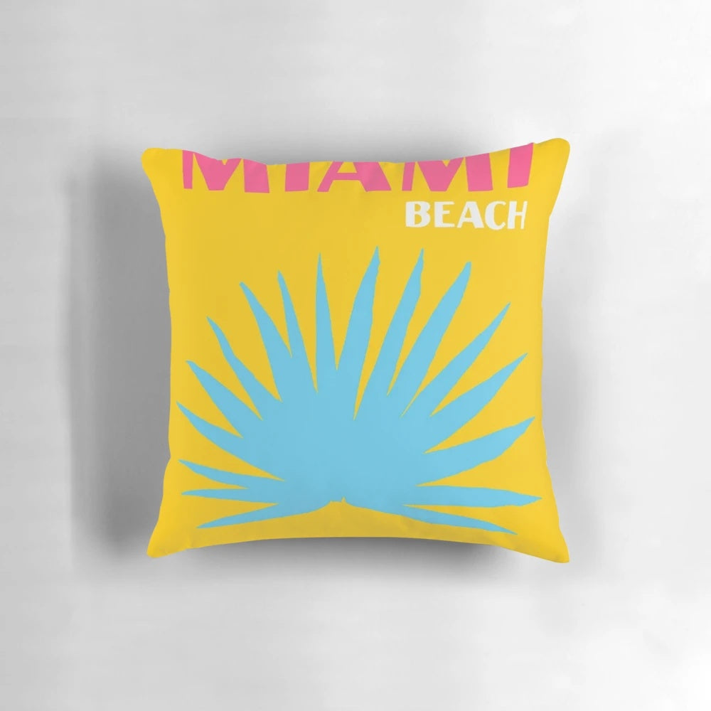 Vibrant tropical-inspired floral cushion with pink and yellow flowers