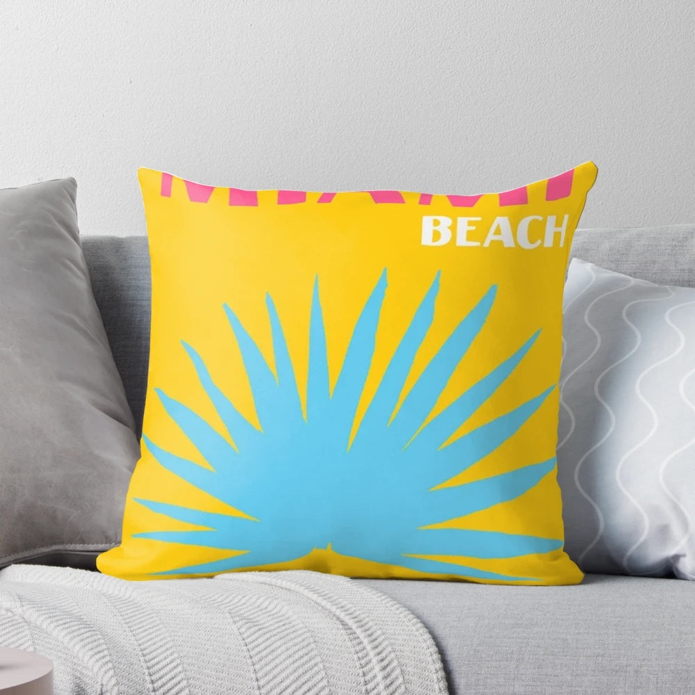 Vibrant tropical-inspired floral cushion with pink and yellow flowers