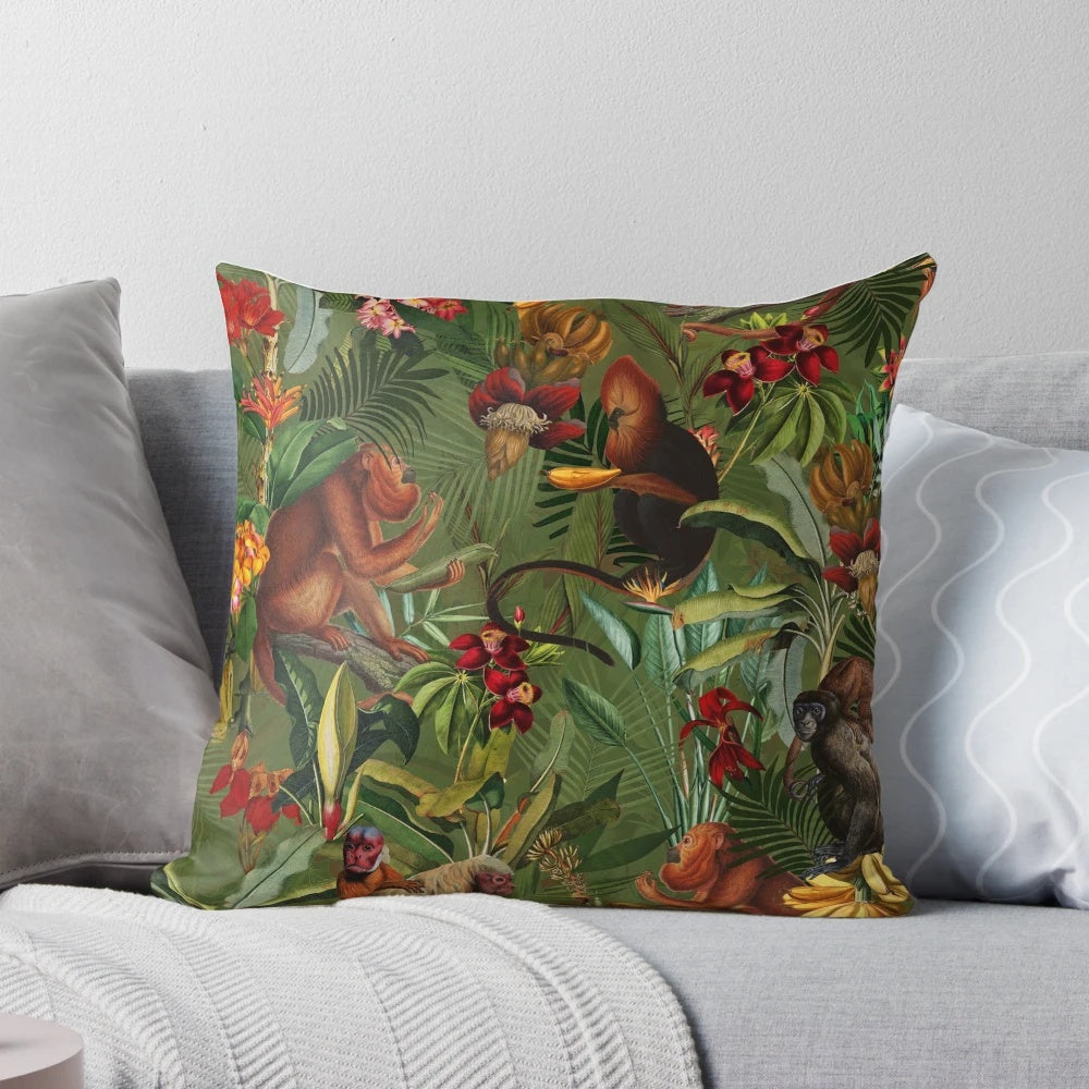 Decorative pillow with a tropical monkey jungle pattern in dark green and botanical floral design.
