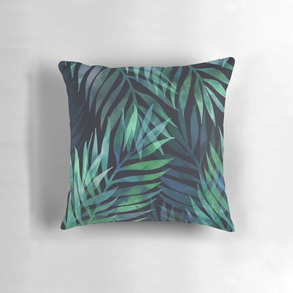 Dark green palm leaves pattern design on a pillow