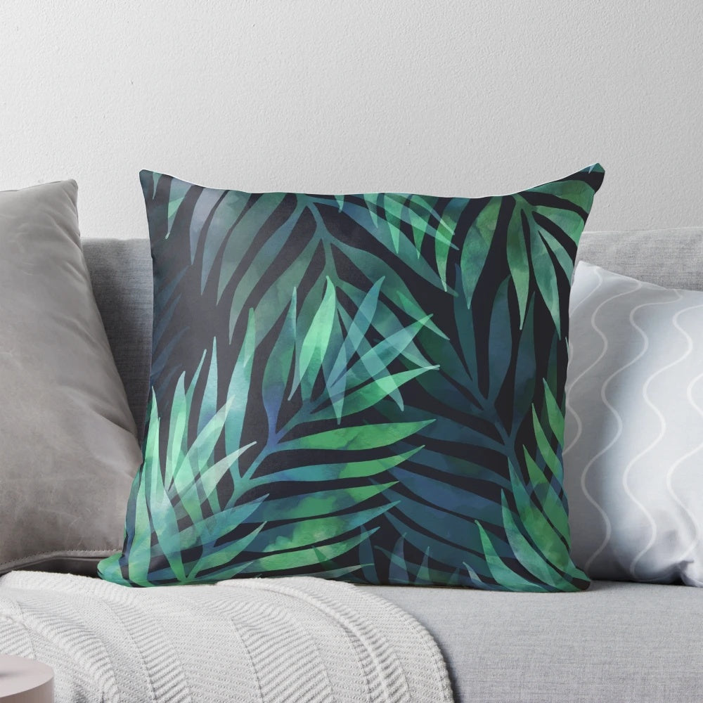 Dark green palm leaves pattern design on a pillow