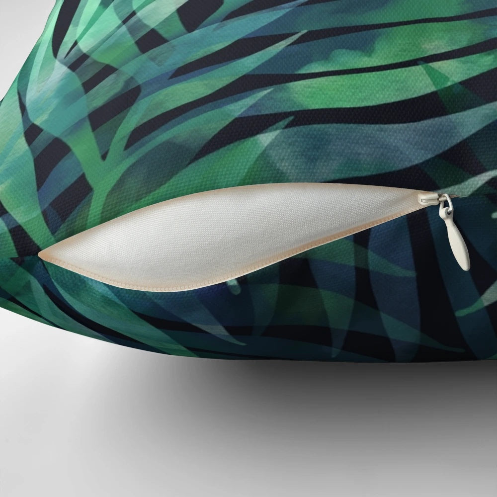 Dark green palm leaves pattern design on a pillow