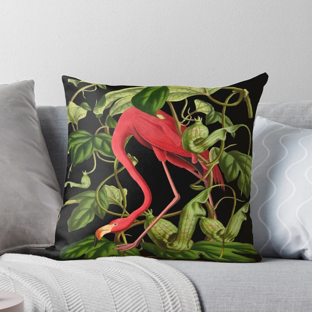 Vibrant pink flamingo pillow with tropical foliage design, perfect for adding a touch of nature-inspired style to your home.