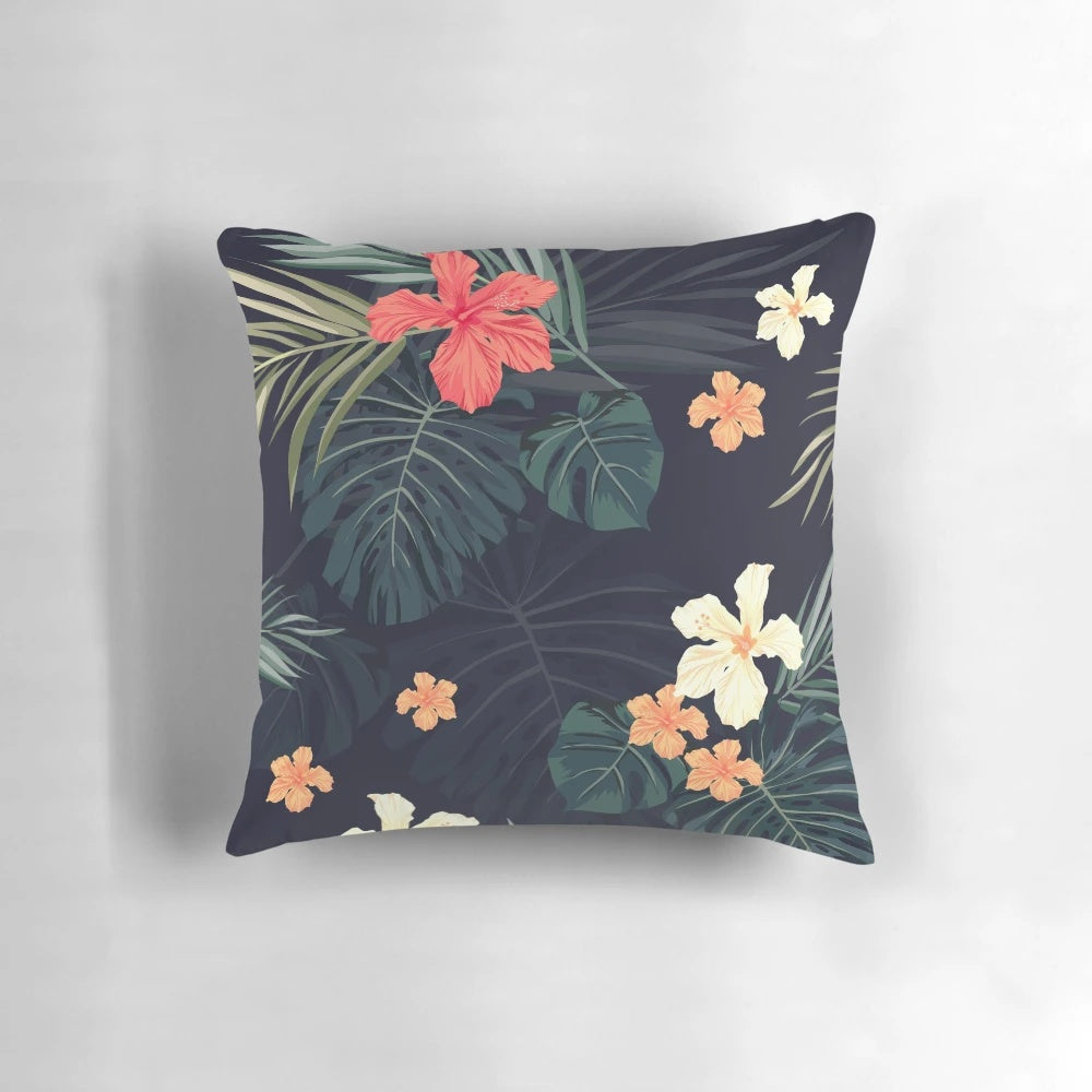 Tropical flowers and botanical foliage pattern on a soft, plush pillow