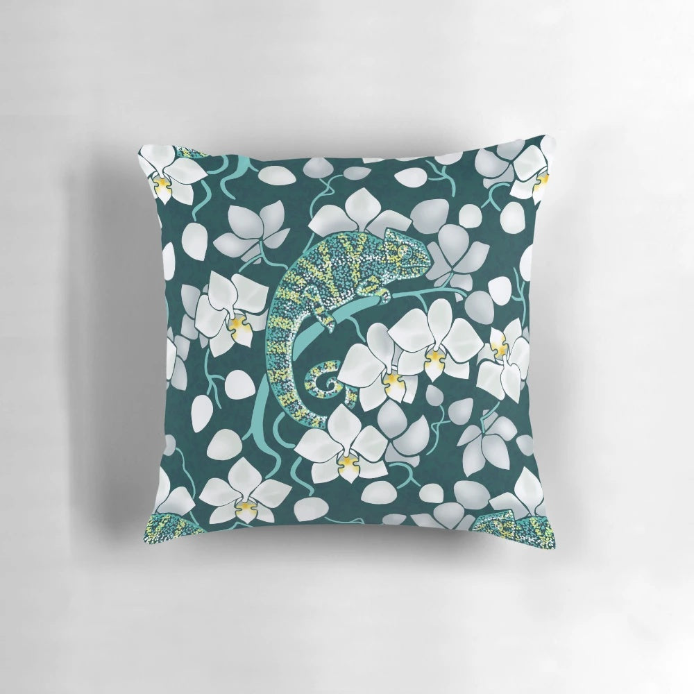 Vibrant tropical floral pillow featuring white orchids and lush greenery