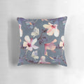 Decorative throw pillow featuring a painted pattern of tropical hibiscus flowers and butterflies in shades of pink, grey, and white.