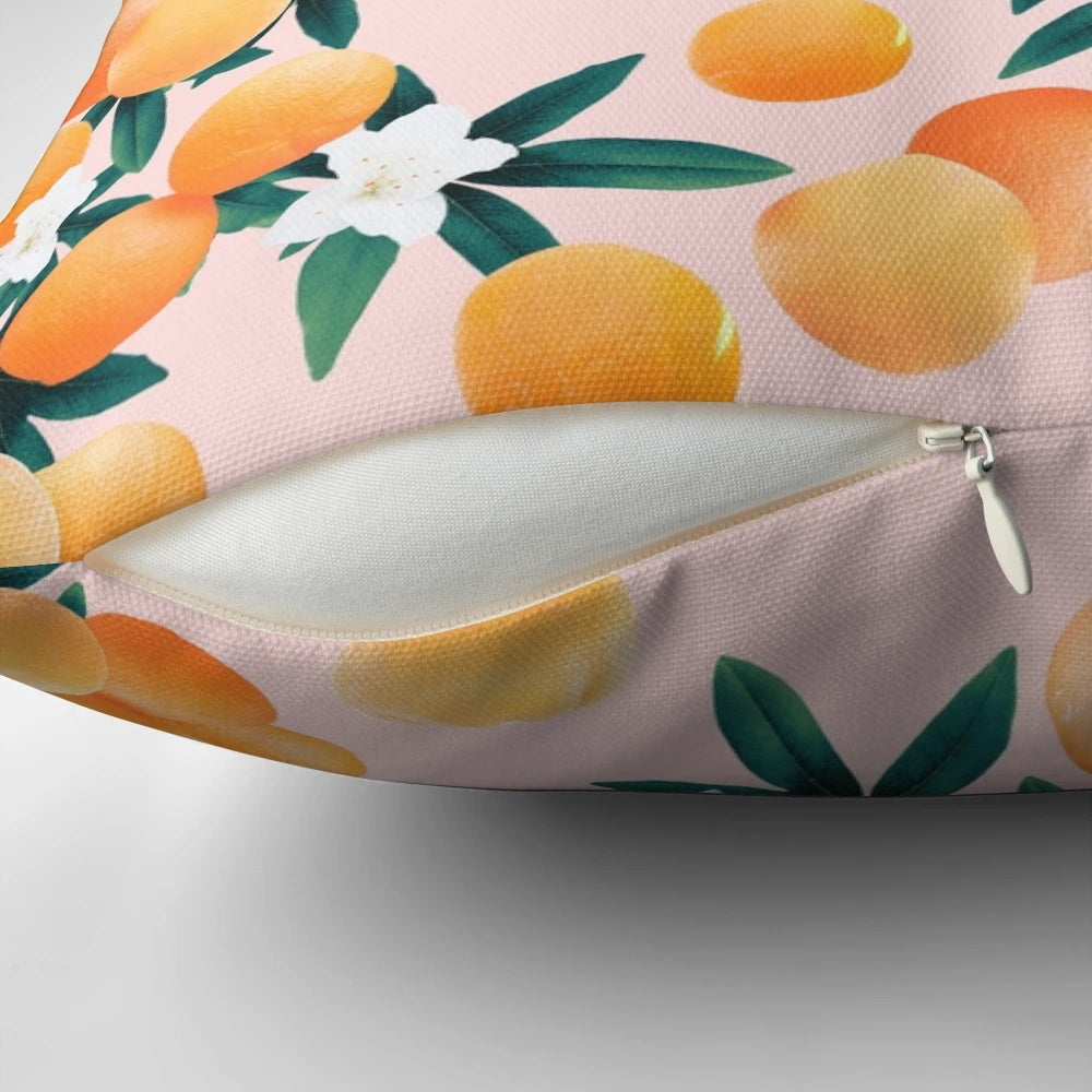 Vibrant orange and green botanical pattern pillow with tropical fruit and floral designs
