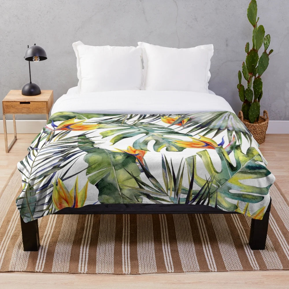 Tropical garden inspired plush blanket featuring watercolor leaves and bird of paradise
