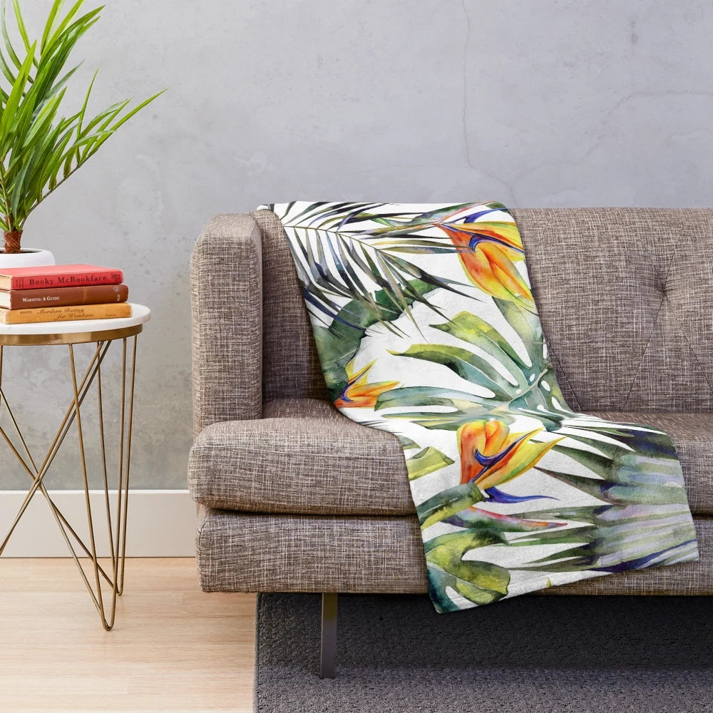 Tropical garden inspired plush blanket featuring watercolor leaves and bird of paradise