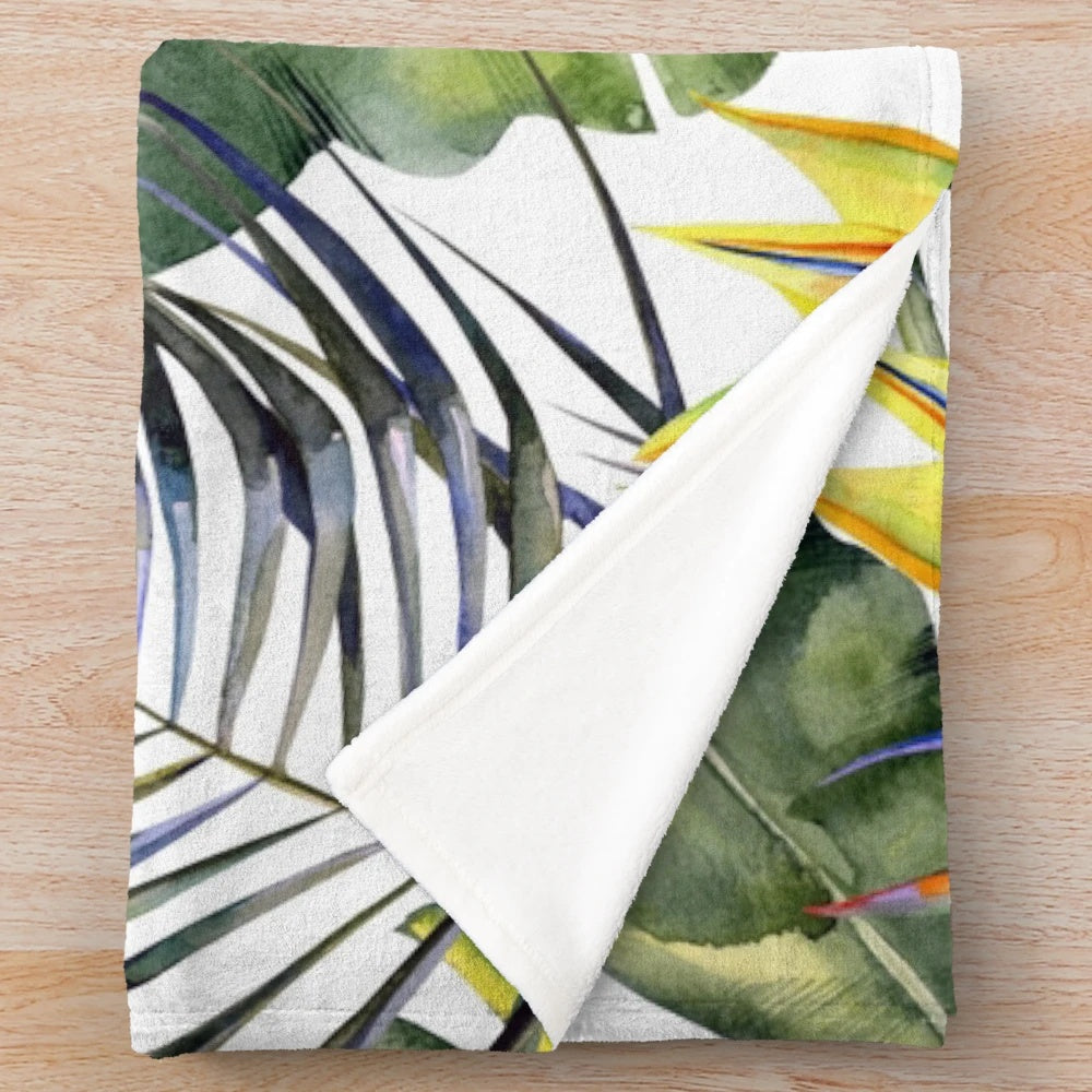 Tropical garden inspired plush blanket featuring watercolor leaves and bird of paradise