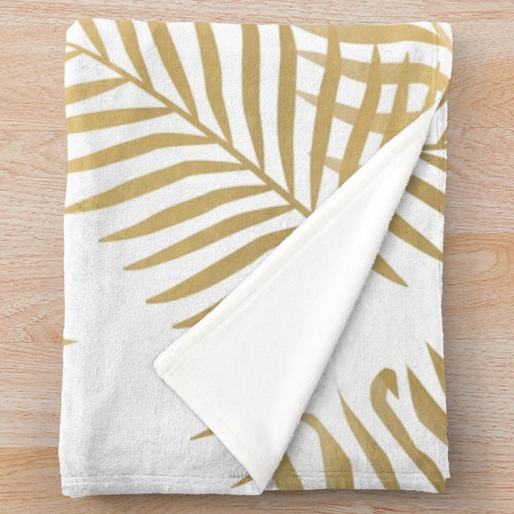 Luxurious gold palm leaves plush blanket for a relaxing, tropical-inspired home
