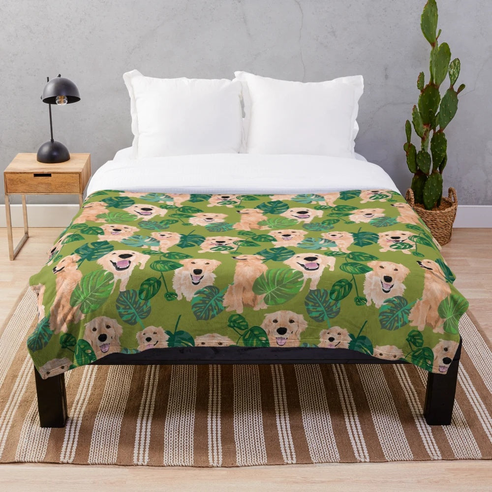 Golden retriever curled up on a tropical-themed plush blanket