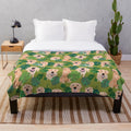 Golden retriever curled up on a tropical-themed plush blanket