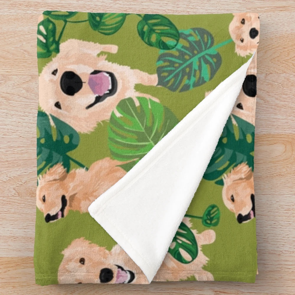 Golden retriever curled up on a tropical-themed plush blanket