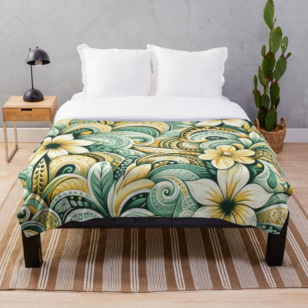 Tropical plush blanket with sunrise colors, floral leaf patterns, and island inspired tribal motifs