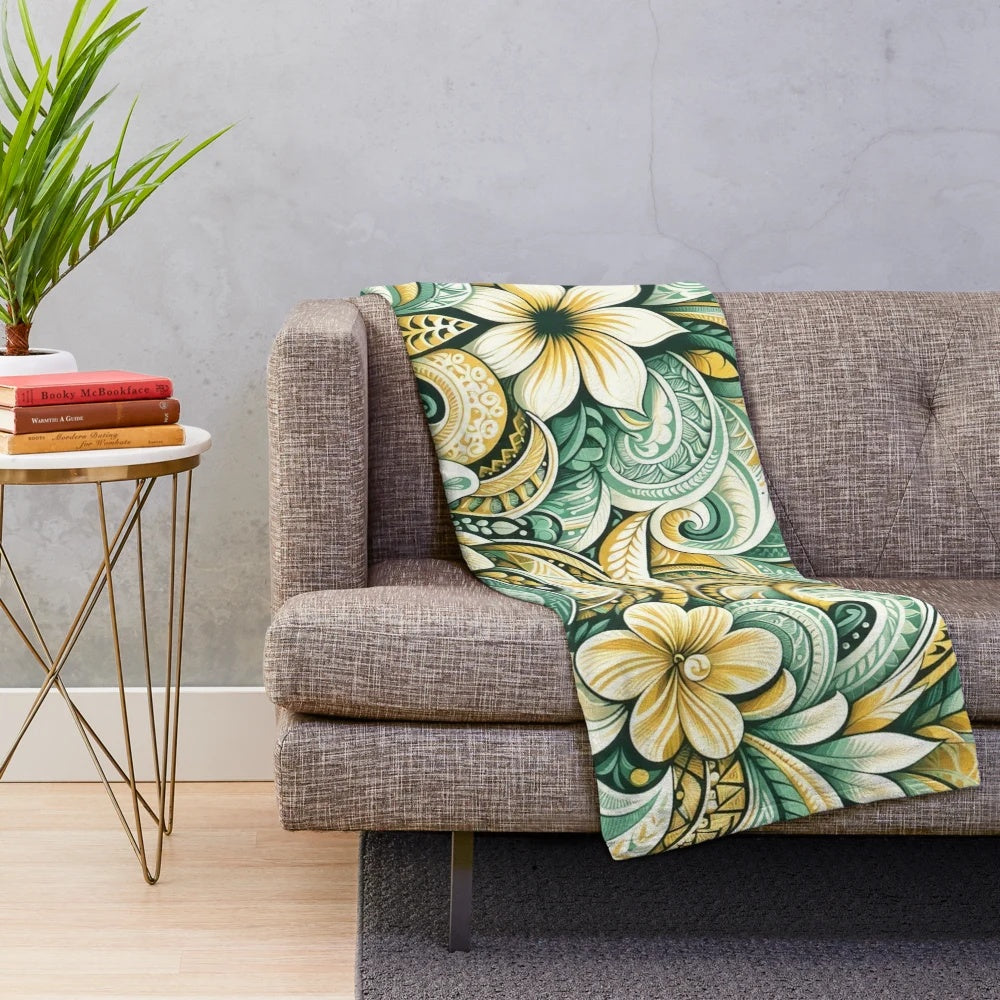 Tropical plush blanket with sunrise colors, floral leaf patterns, and island inspired tribal motifs