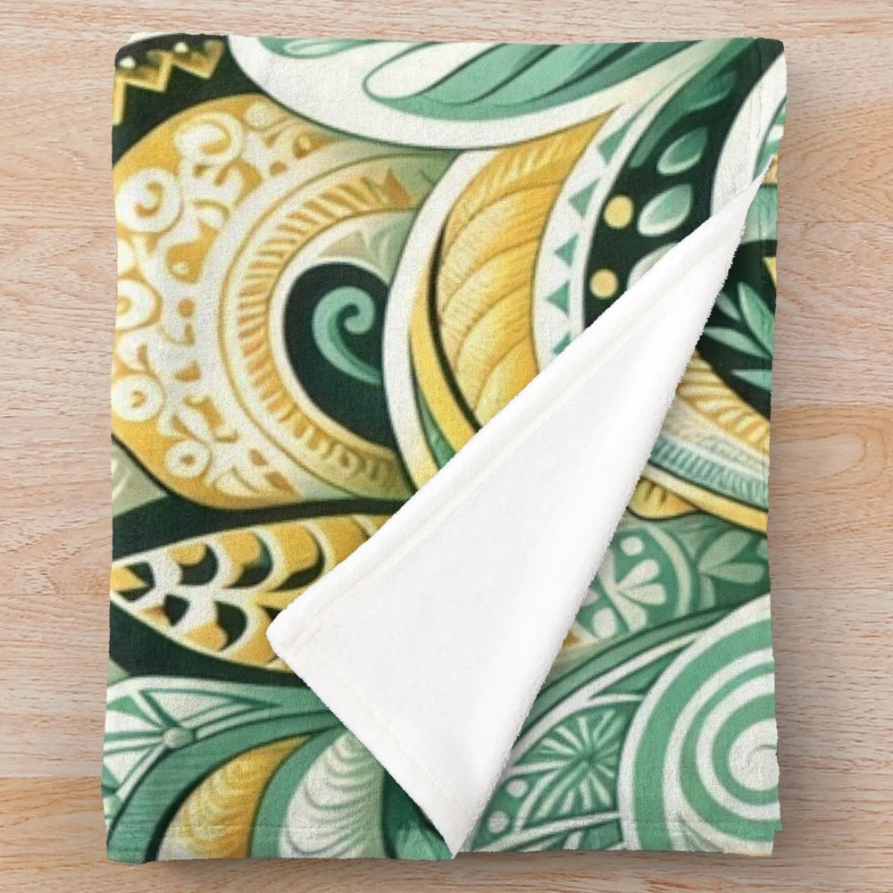 Tropical plush blanket with sunrise colors, floral leaf patterns, and island inspired tribal motifs