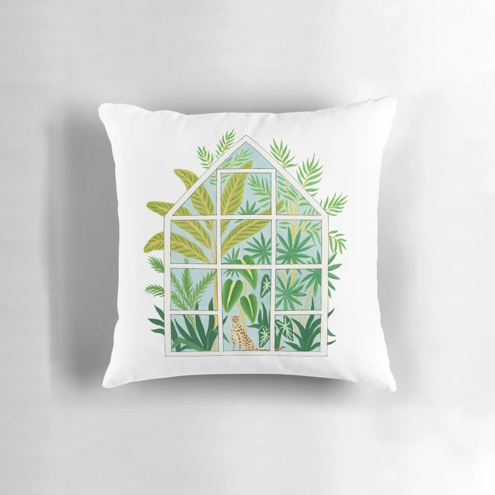 Tropical jungle greenhouse throw pillow with hand-drawn palm trees, greenery, and leopard print